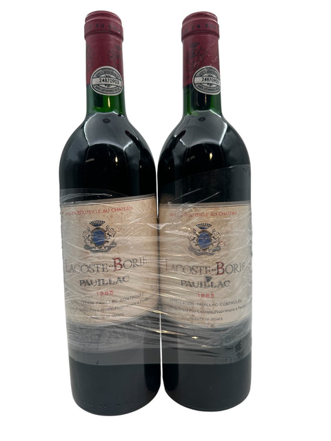 Lacoste Borie Pauillac 1985 one bottle has a loose label (price for both) – bottle